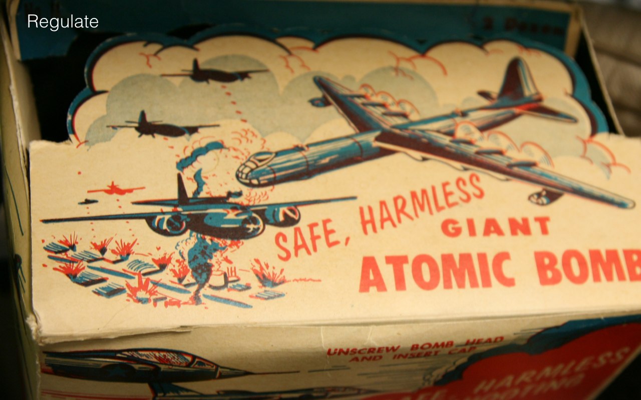 Old toy box with text on it: save harmless giant atomic bomb.